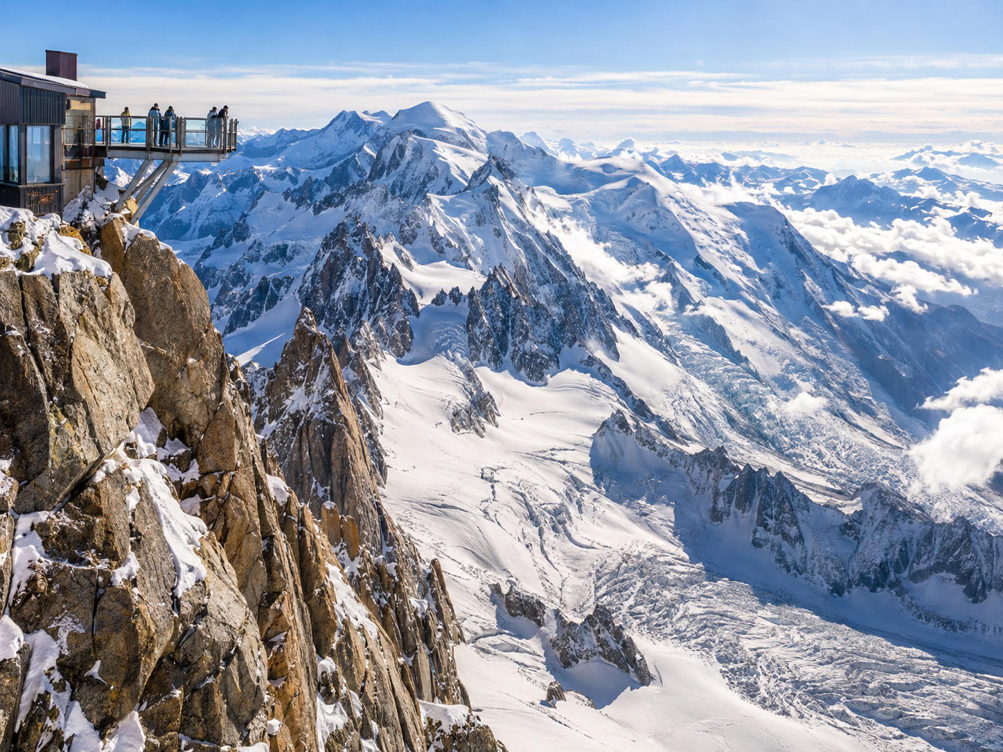 High-altitude viewing platform overlooking snowy peaks in the French Alps