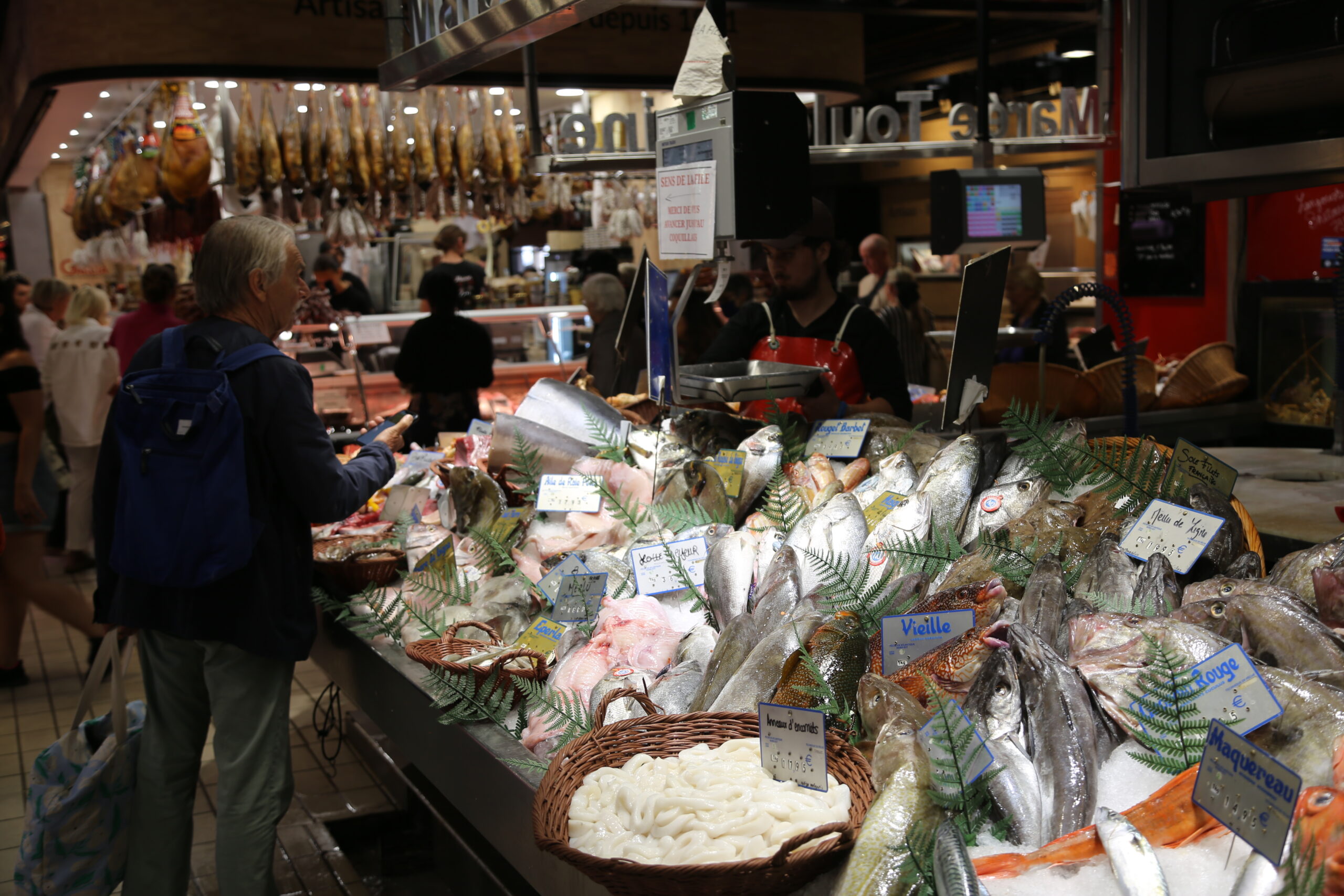 Cheese stall inside the Victor Hugo Market in Toulouse